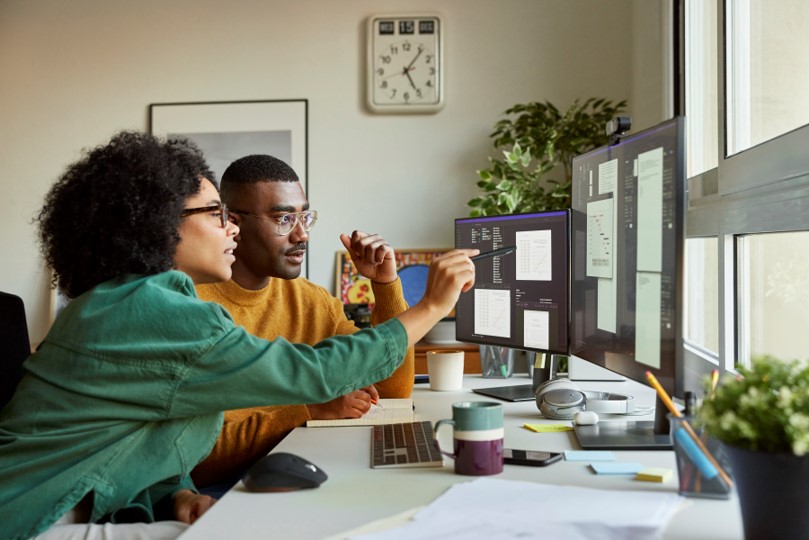 Two people at a computer